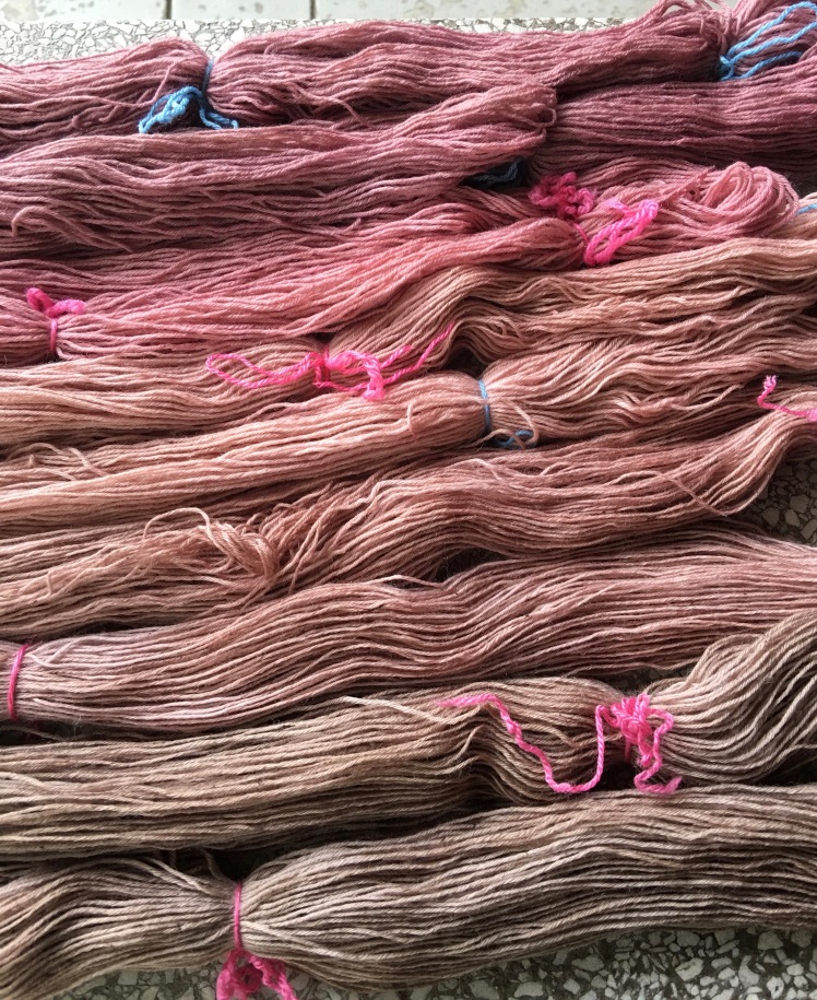 Yarn dyed in fermented hibiscus dye with acidic modifier