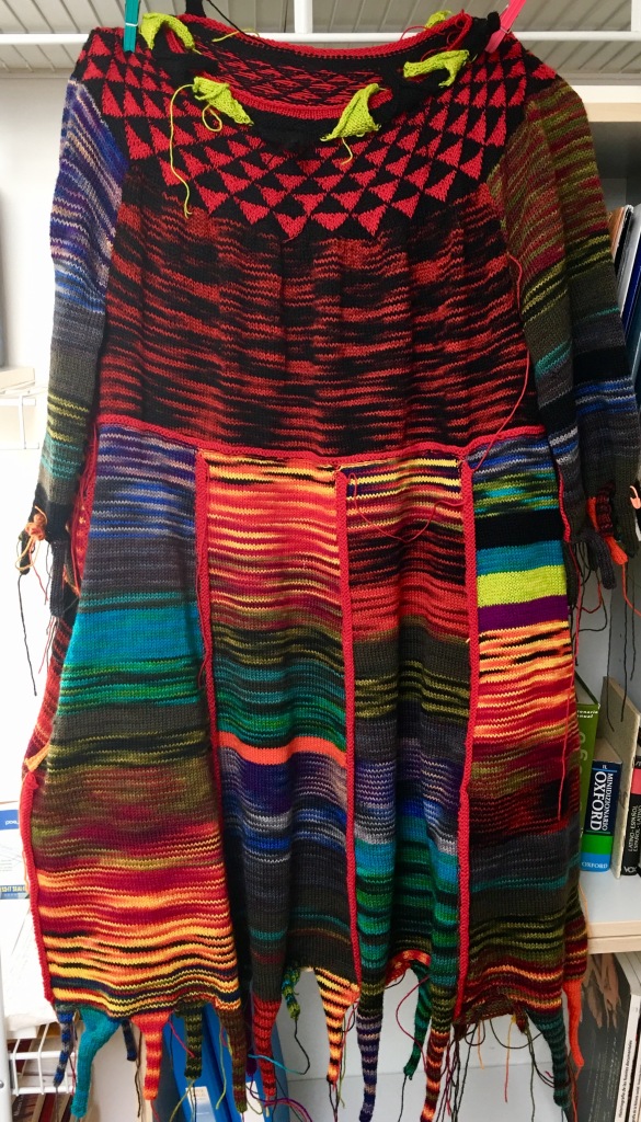 Machine-knitted dress at finishing phase