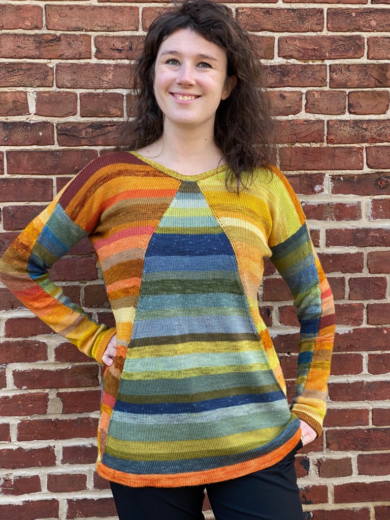 Modeled machine-knit pullover with triangle-shaped paneled motif on front